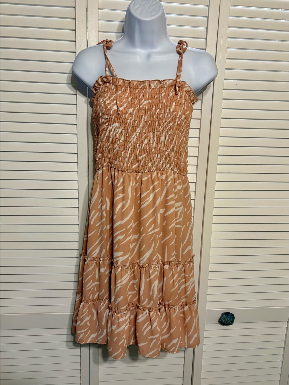 Sleeveless Smocked Tiered Dress in Peach Abstract Print